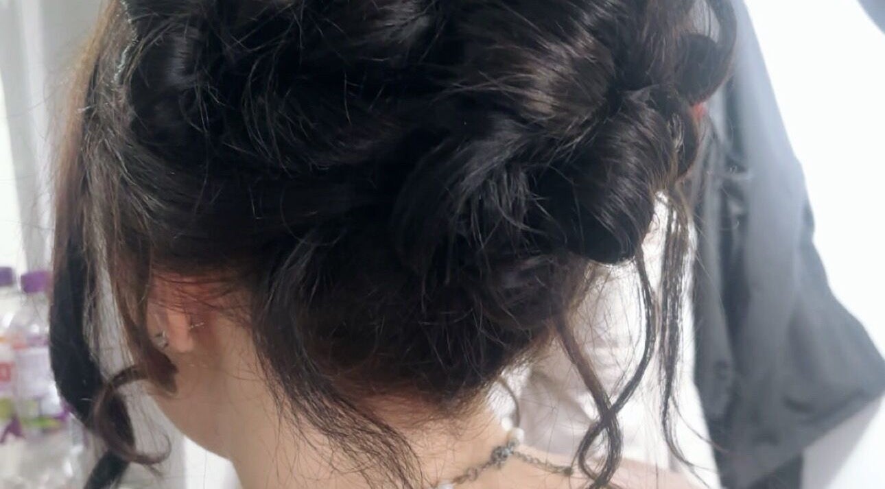 Intricate hair updo crafted at Nails by Sienna, Pontefract, England, GB, showcasing modern hairstyling.
