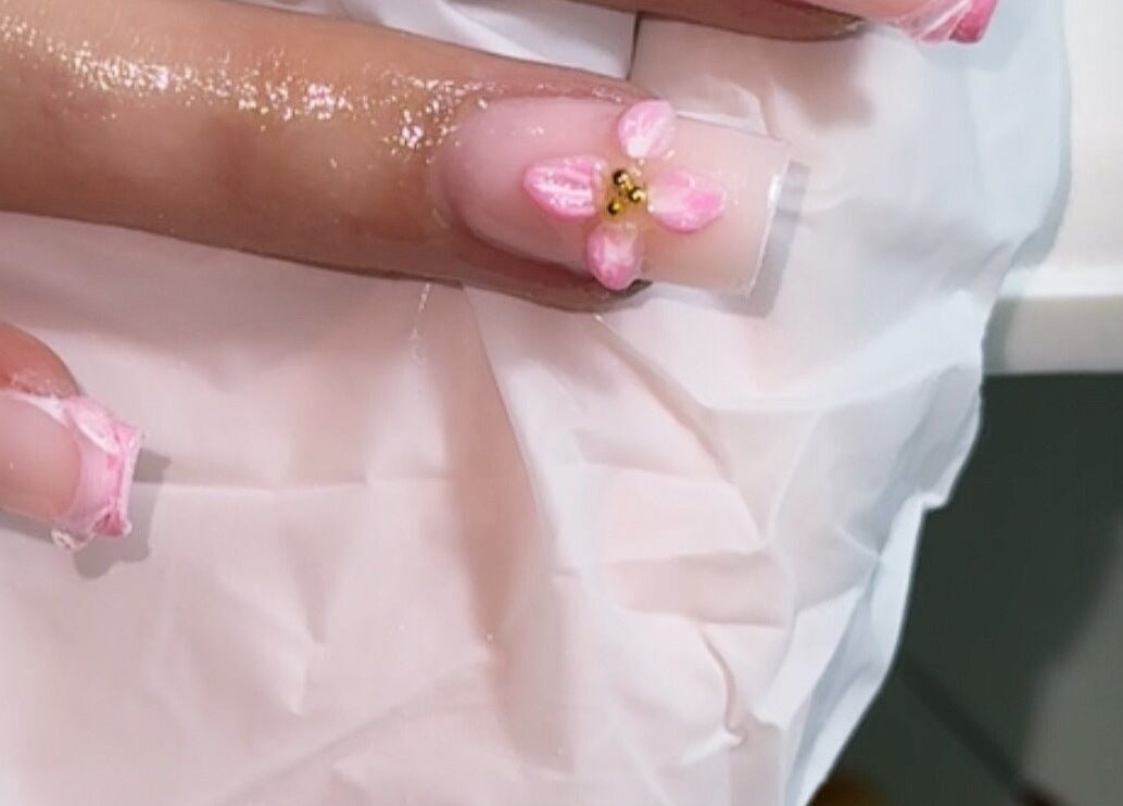 Detailed pink floral nail art at Nails by Sienna, Pontefract, England, GB.