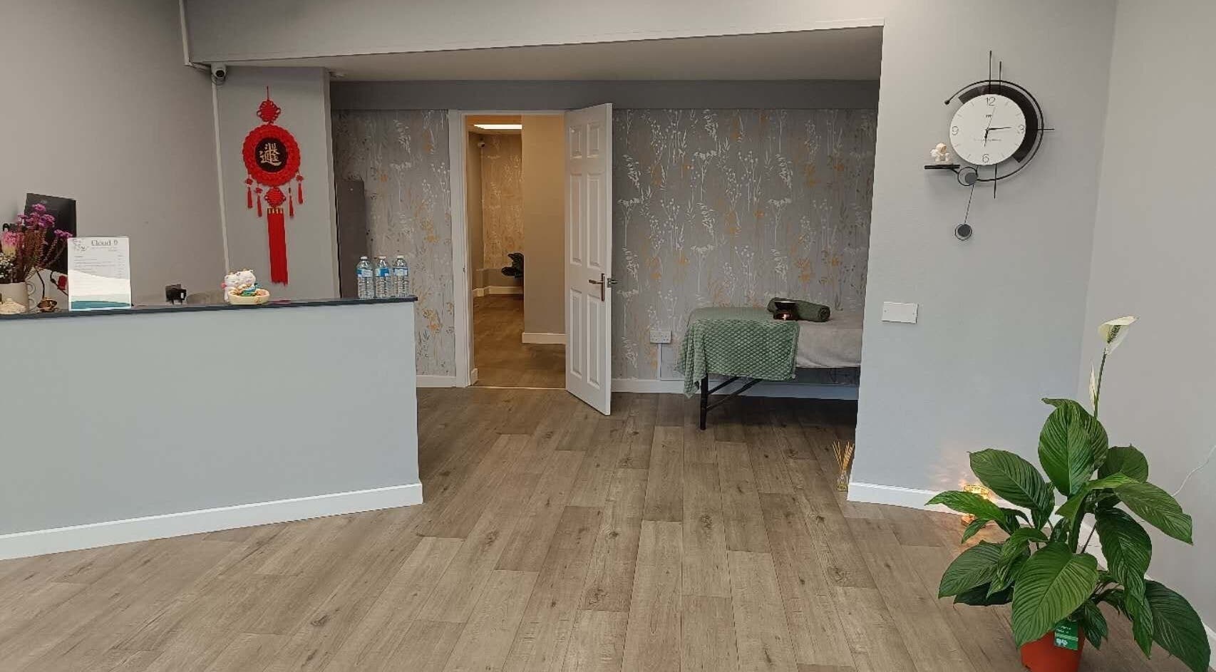 Reception area of Cloud 9 Wellness Spa & Rooms, Newcastle Under Lyme, England, featuring serene decor.