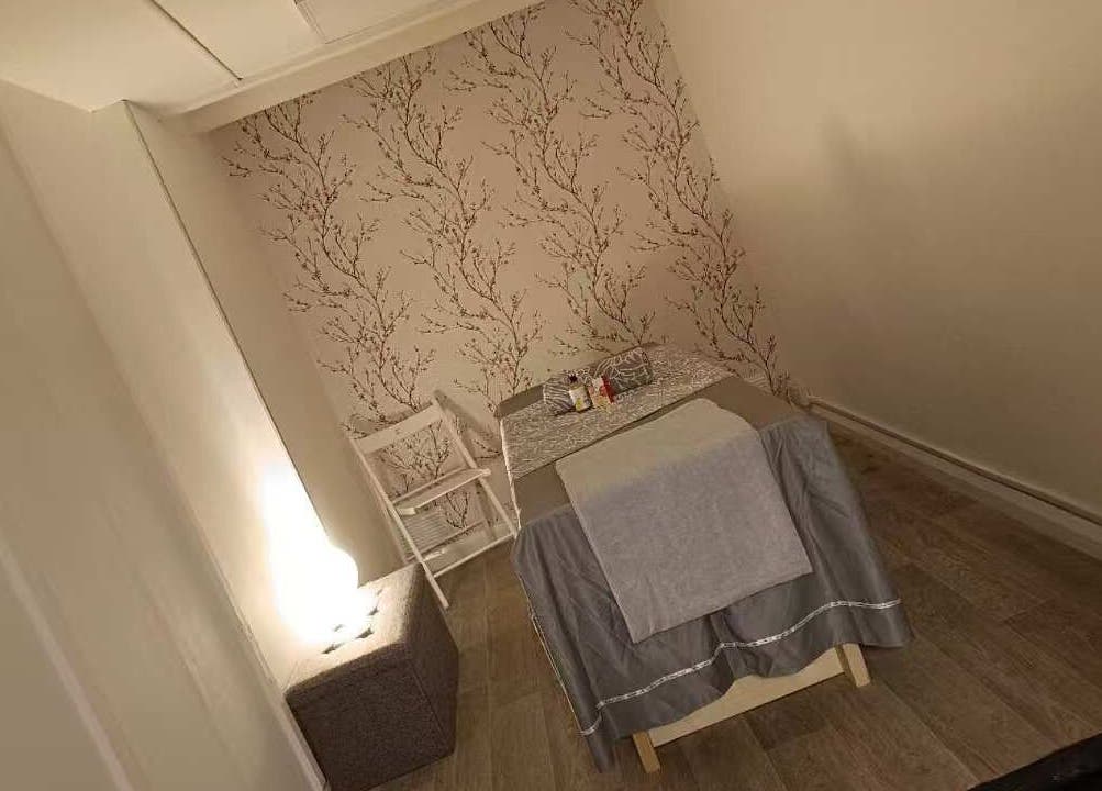 Tranquil massage room at Cloud 9 Wellness Spa & Rooms, Newcastle Under Lyme, England, featuring cozy decor.