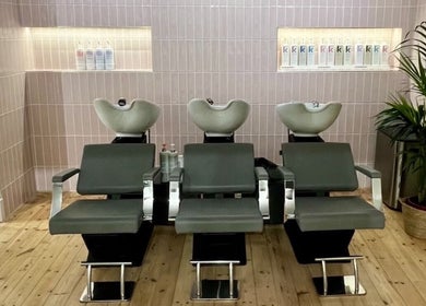 Modern wash stations at Erin Hunt Hairdressing in Edinburgh, Scotland, GB offer a sleek salon experience.
