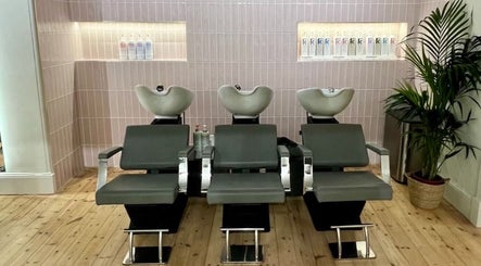 Modern wash stations at Erin Hunt Hairdressing, Edinburgh, Scotland, GB. Sleek design for luxurious hair treatments.