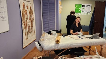 Body in Mind Massage Institute - West New York, NJ office interior view with staff at work. West New York, New Jersey, US.