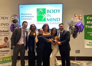 Graduates celebrating at Body in Mind Massage Institute - West New York, NJ.