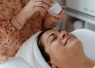 Relaxed client receiving a facial at Flourish Skin & Beauty, Wānaka, Otago, NZ.