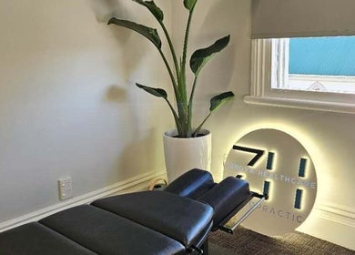 Relaxing treatment room at Zenova Healthcare Chiropractic, Auckland, Auckland, NZ, featuring a massage table.