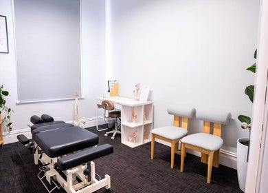 Zenova Healthcare Chiropractic's therapy room in Auckland, NZ features a treatment table and calming decor.
