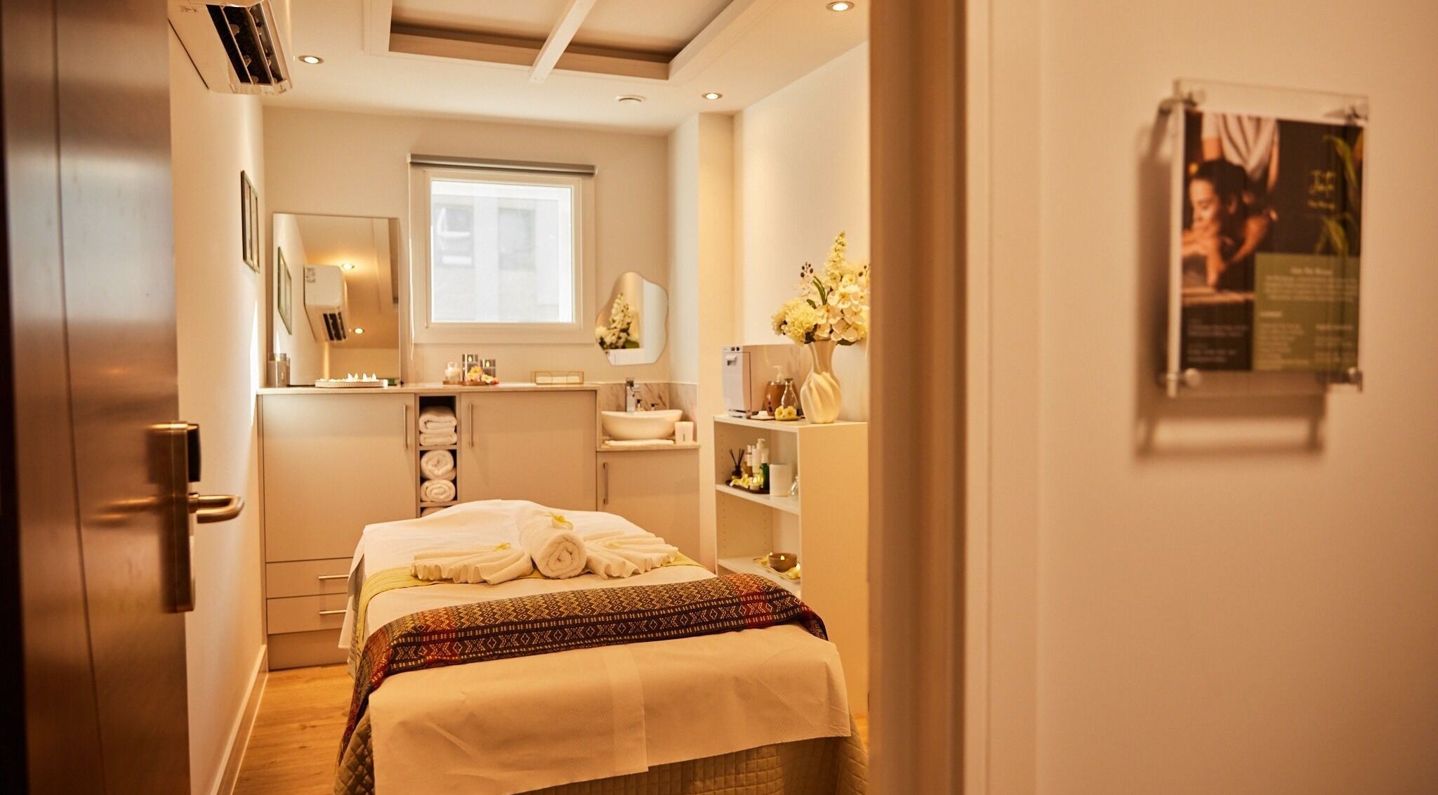 Tranquil massage room at Jinta Thai Massage, London, England, GB, offering a serene wellness experience.