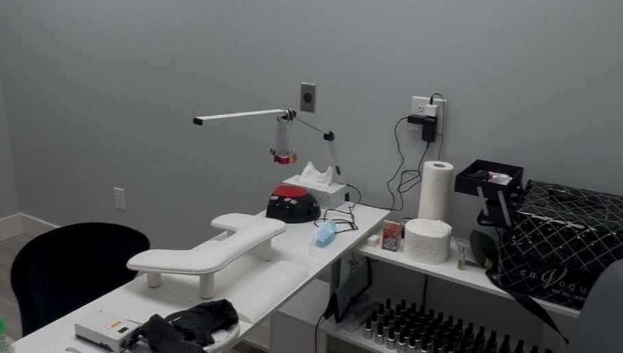 Modern nail station at Boujee Nail Boo in Thunder Bay, Ontario, CA, featuring manicure tools and comfy seating.