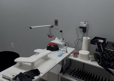 Modern nail station at Boujee Nail Boo in Thunder Bay, Ontario, CA, featuring manicure tools and comfy seating.