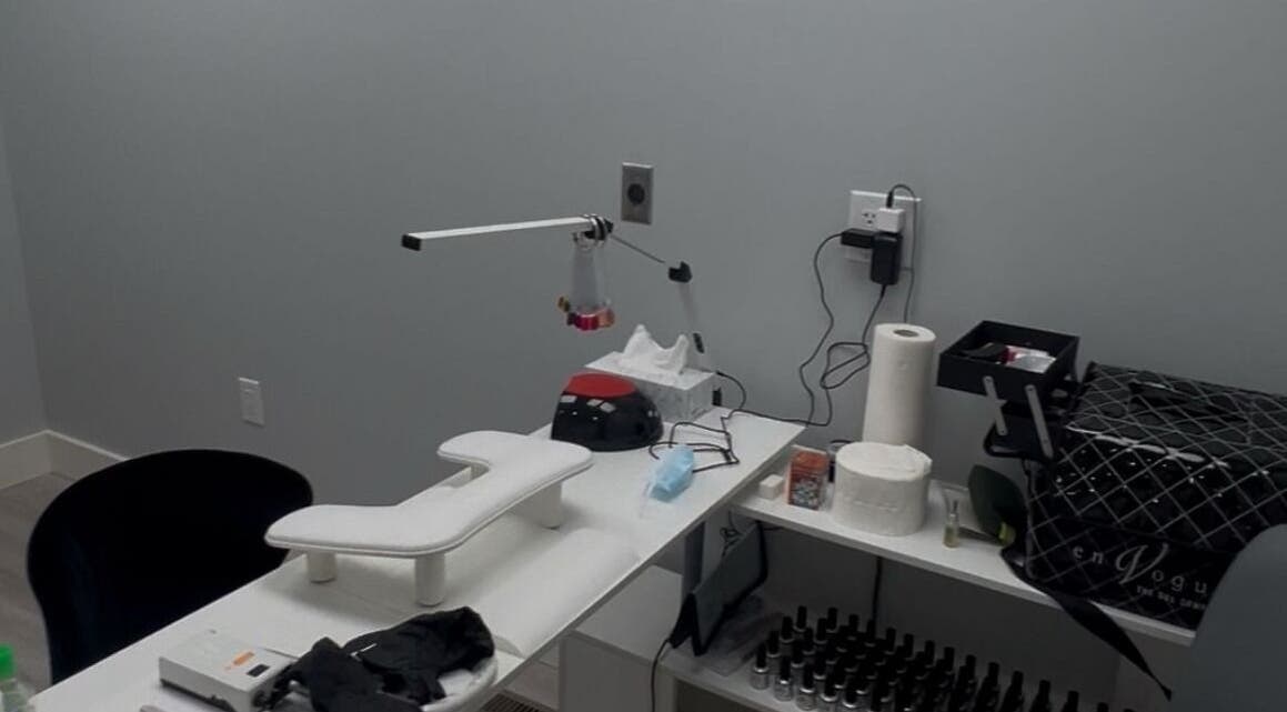 Modern nail station at Boujee Nail Boo in Thunder Bay, Ontario, CA, featuring manicure tools and comfy seating.