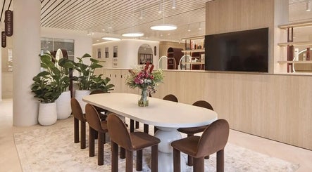 Stylish lounge area at Aidan Gardner Hair, Bondi Junction, New South Wales, AU with modern decor and seating.