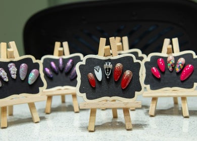 Elegant nail art designs on easels at Nail Decor by Prapti, Navi Mumbai, Maharashtra, IN.