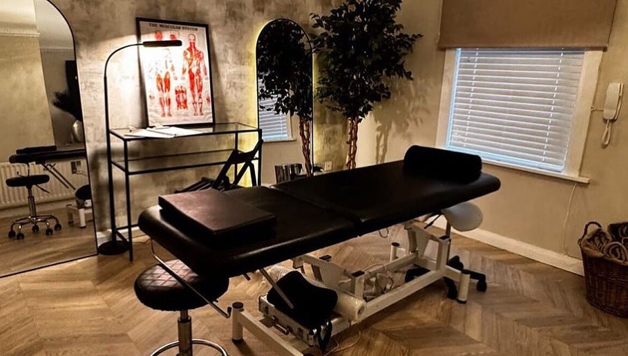 Therapy room at By Ellie Aesthetics, Liverpool, England, GB, featuring a massage table and soothing décor.