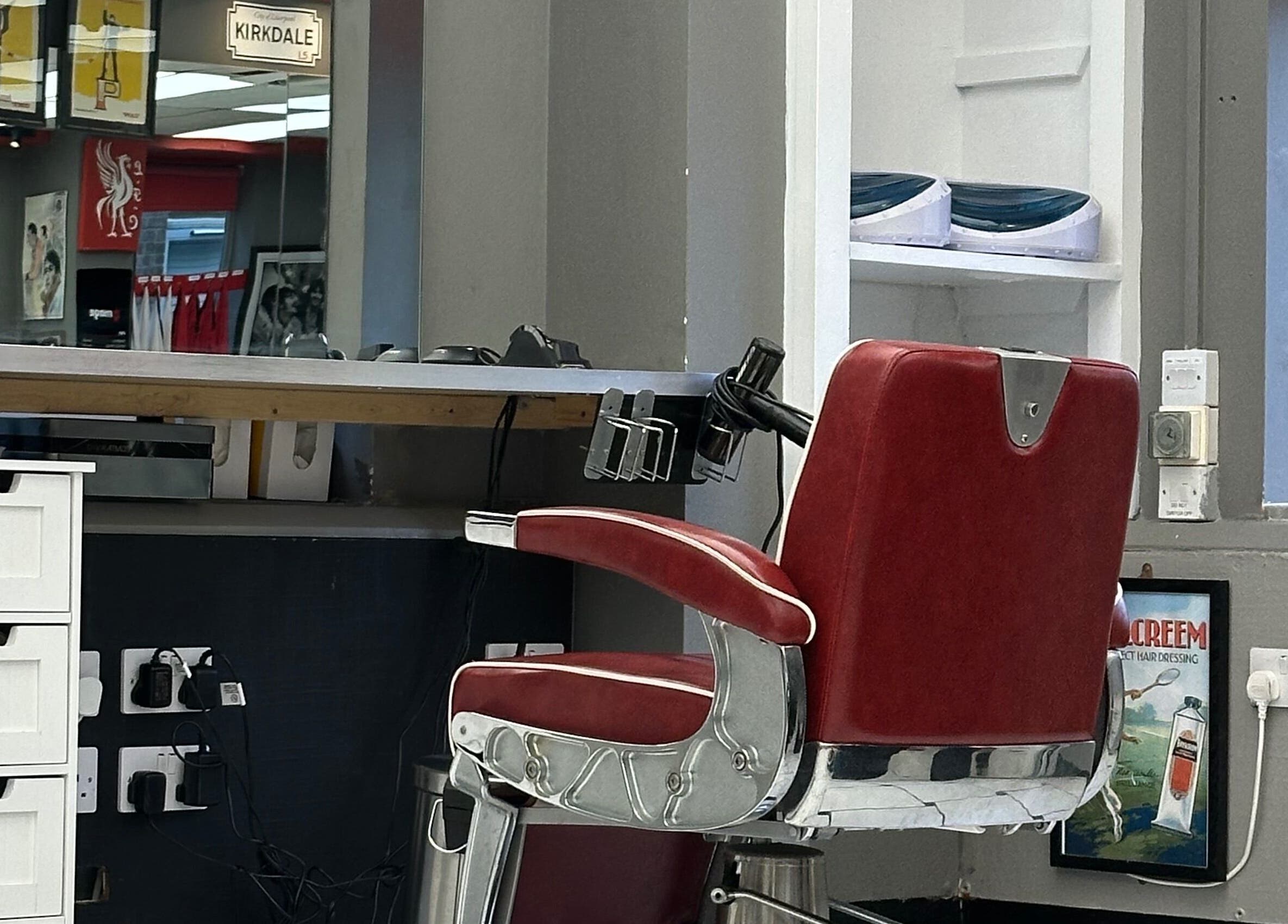 Vintage barber chair at Image Barbers, Saint Helier, St Helier, JE. Modern, inviting space.