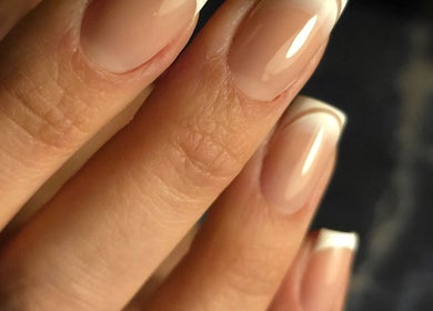 Elegant French manicure at Italmas Nails Inc., New York, New York, US. Perfectly crafted for modern style.