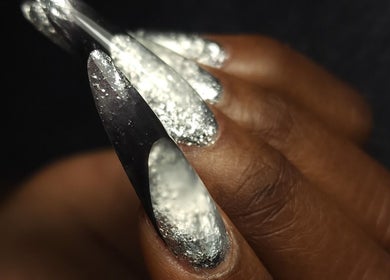 Elegant silver metallic nails by Italmas Nails Inc. in New York, New York, US.