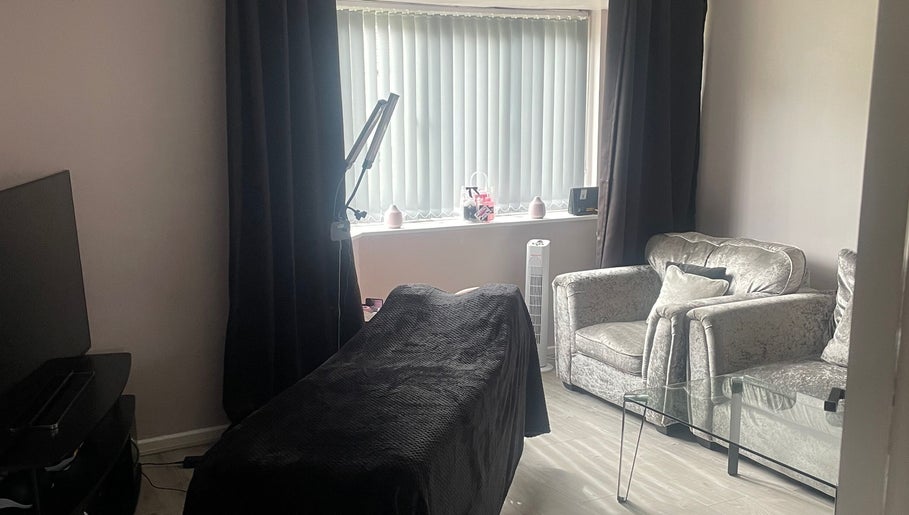 Cozy treatment area at Lashes After Hours, Sheffield, England, GB, with stylish seating and soothing decor.