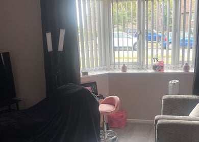 Bright beauty treatment area at Lashes After Hours, Sheffield, England, GB with elegant furniture and large window.