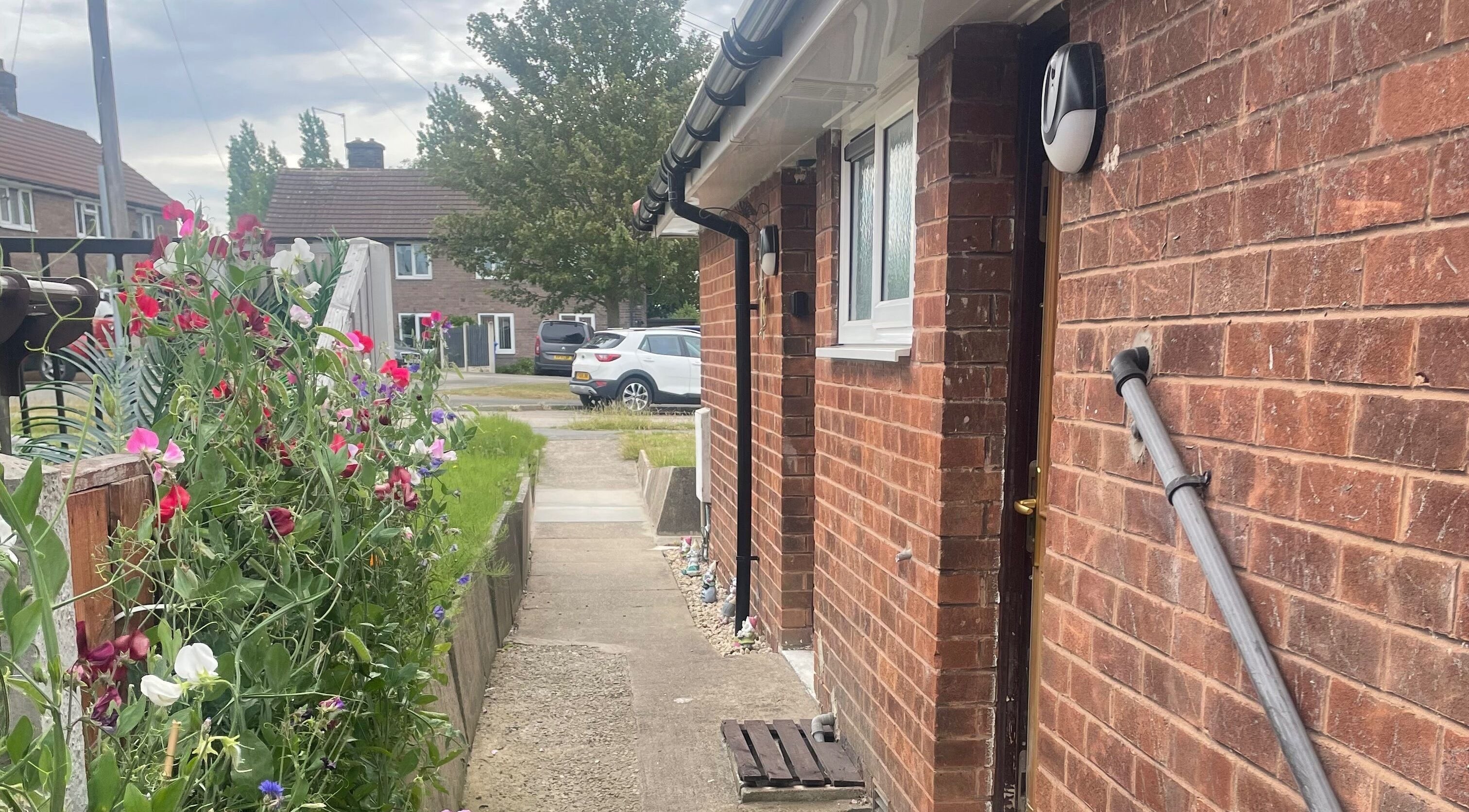 Brick exterior with garden view at Lashes After Hours, Sheffield, England, GB.