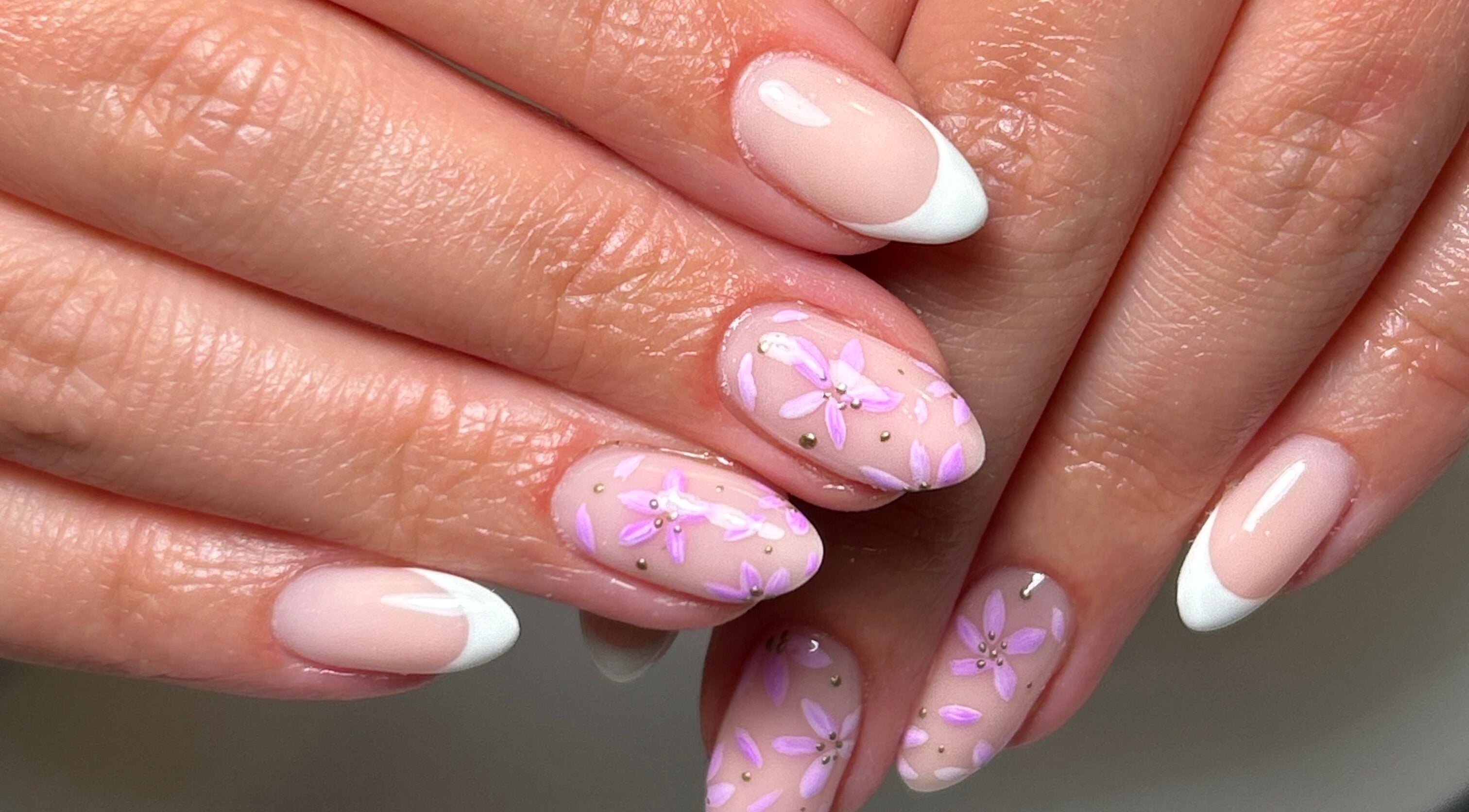 Elegant floral nail art with French tips at Gelsby.krissy, Baildon, England, GB.
