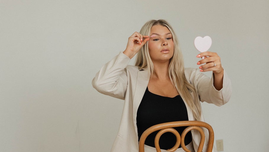 Woman applying lashes at Lashed by Ches, Johnson City, Tennessee, US.