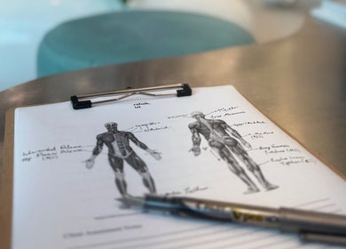 Anatomy sketches on a clipboard at The Rehabist, Singapore, Singapore, SG for wellness and therapy.