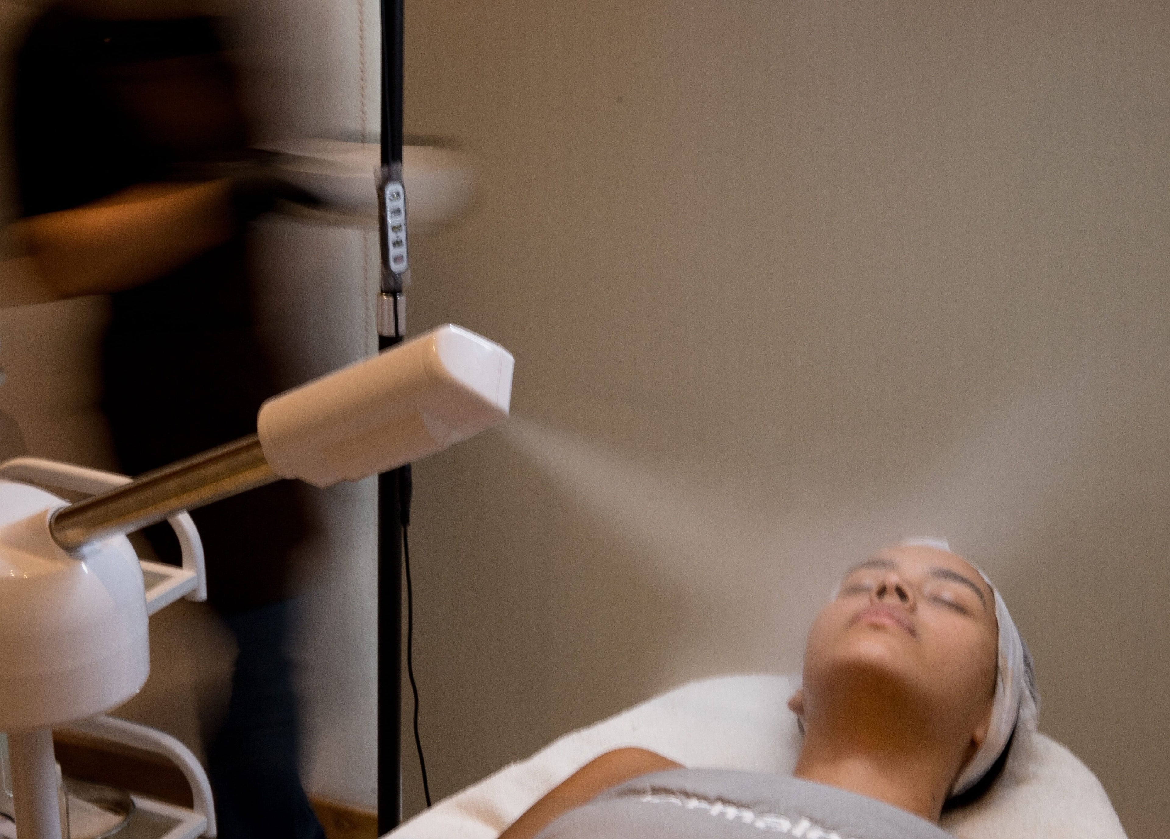 Facial treatment at Estetica Belle, Kabupaten Badung, Bali, ID. Woman receiving relaxing steam therapy.