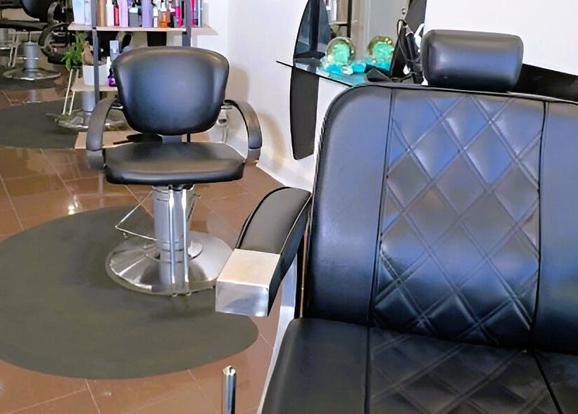 Modern salon chairs at Ivolve Hair Studio, Mississauga, Ontario, CA. Sleek design for ultimate comfort.