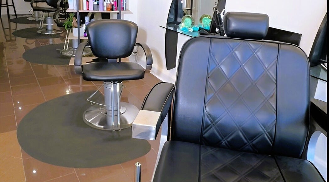 Modern salon chairs at Ivolve Hair Studio, Mississauga, Ontario, CA. Sleek design for ultimate comfort.