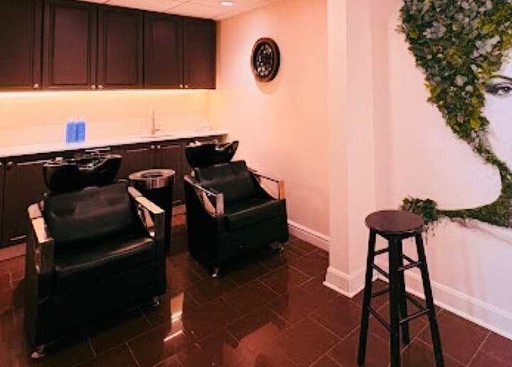 Modern salon interior at Ivolve Hair Studio, Mississauga, Ontario, CA with stylish art and chic wash stations.