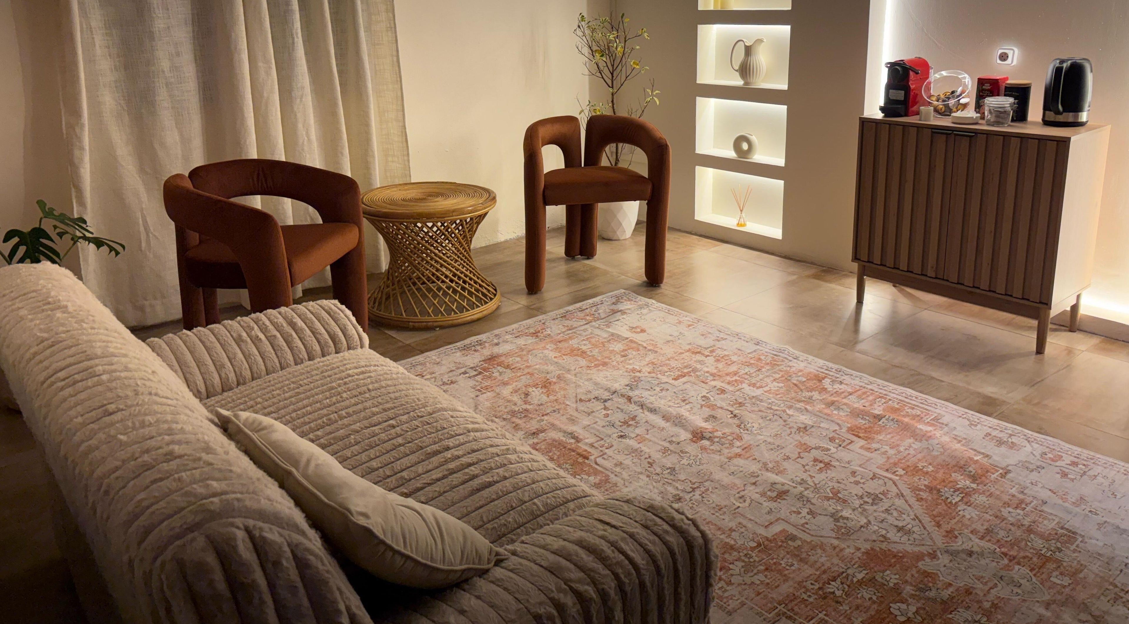 Alké Studio's inviting waiting area in Vacoas-phoenix, Plaines Wilhems District, MU featuring warm seating and elegant decor.