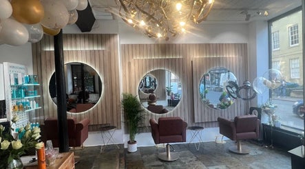 Elegant interior of SariaStyles in Bristol, England, GB with stylish mirrors and chic decor.