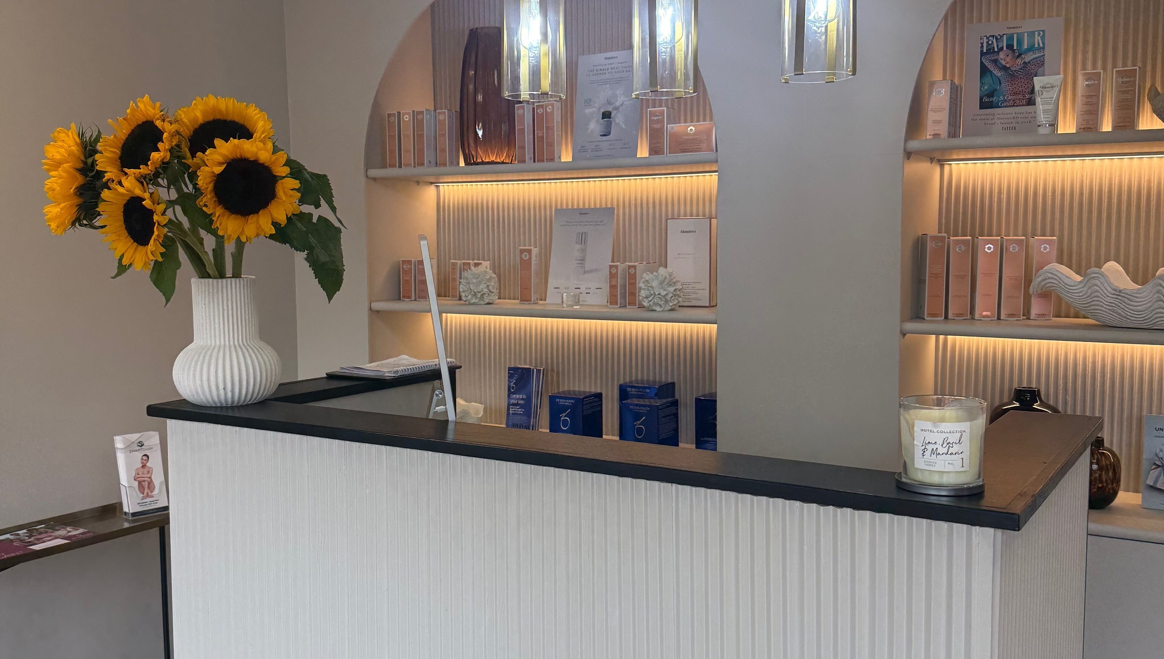 Elegant reception with sunflowers at ByMorgan, Welton, England, GB. Inviting ambiance showcases beauty products.