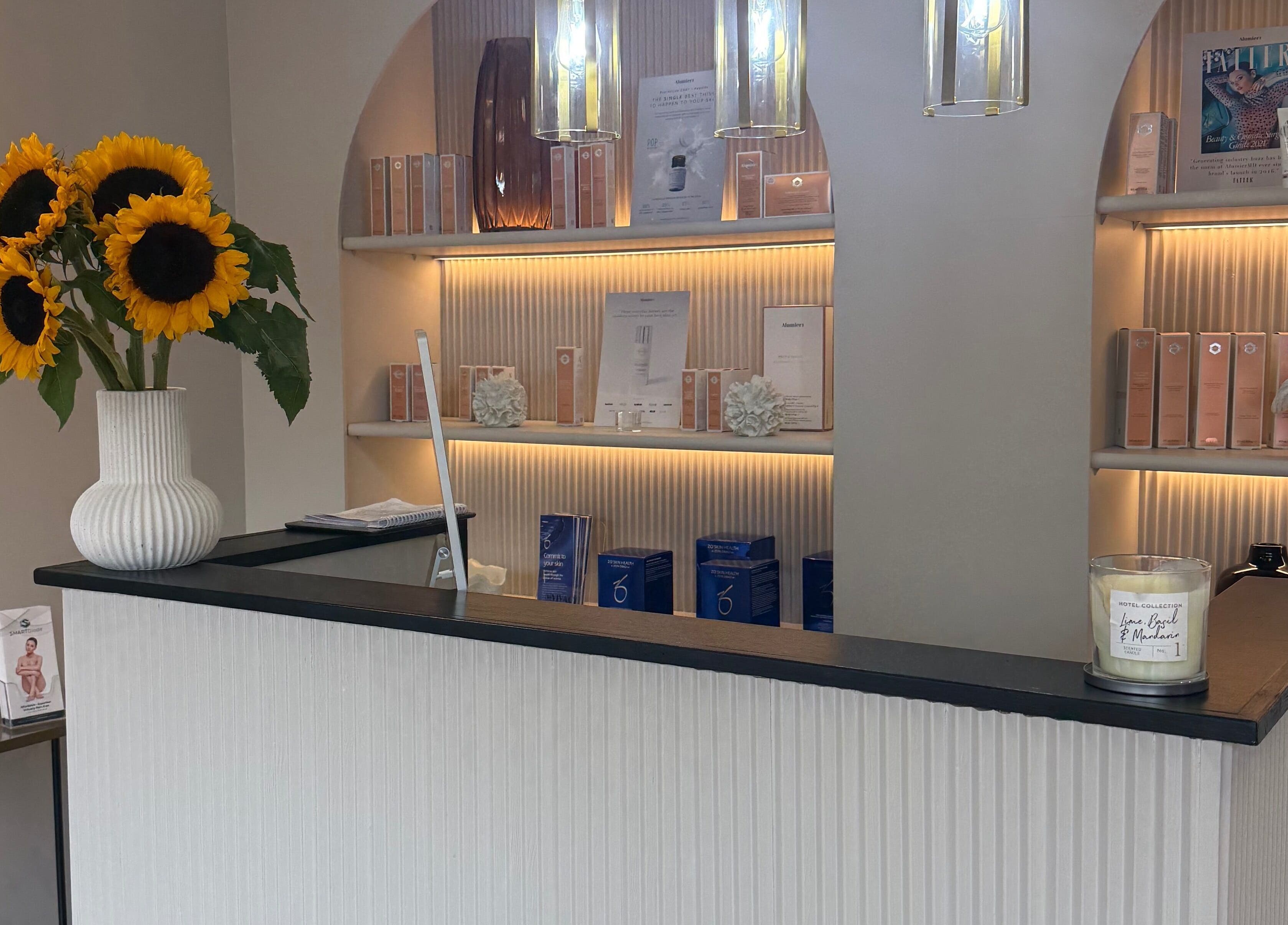 Elegant reception with sunflowers at ByMorgan, Welton, England, GB. Inviting ambiance showcases beauty products.