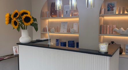 Elegant reception with sunflowers at ByMorgan, Welton, England, GB. Inviting ambiance showcases beauty products.