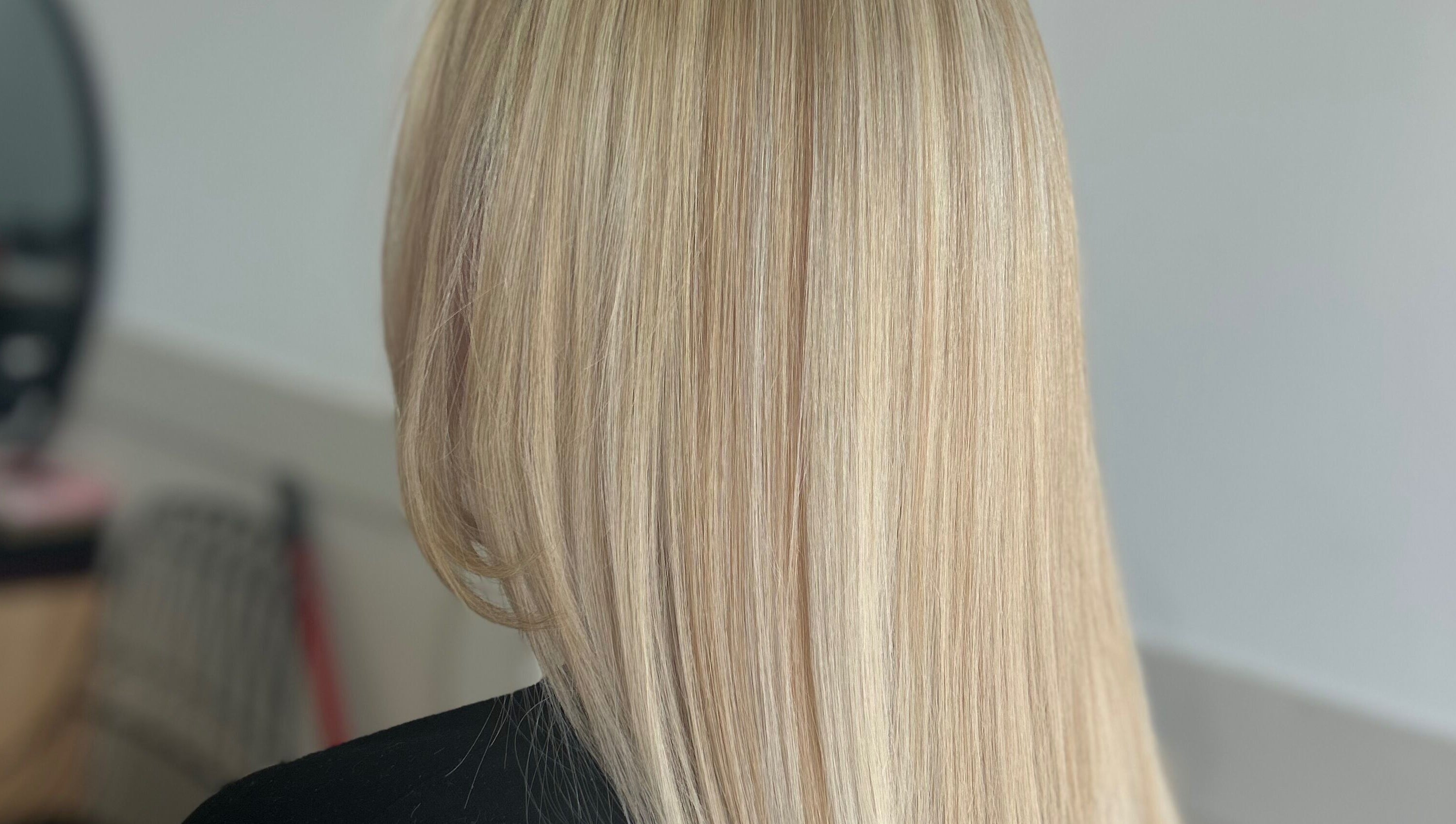 Sleek blonde hairstyle at Styled By Tee Swales in Hartlepool, England, GB, showcasing precise styling.