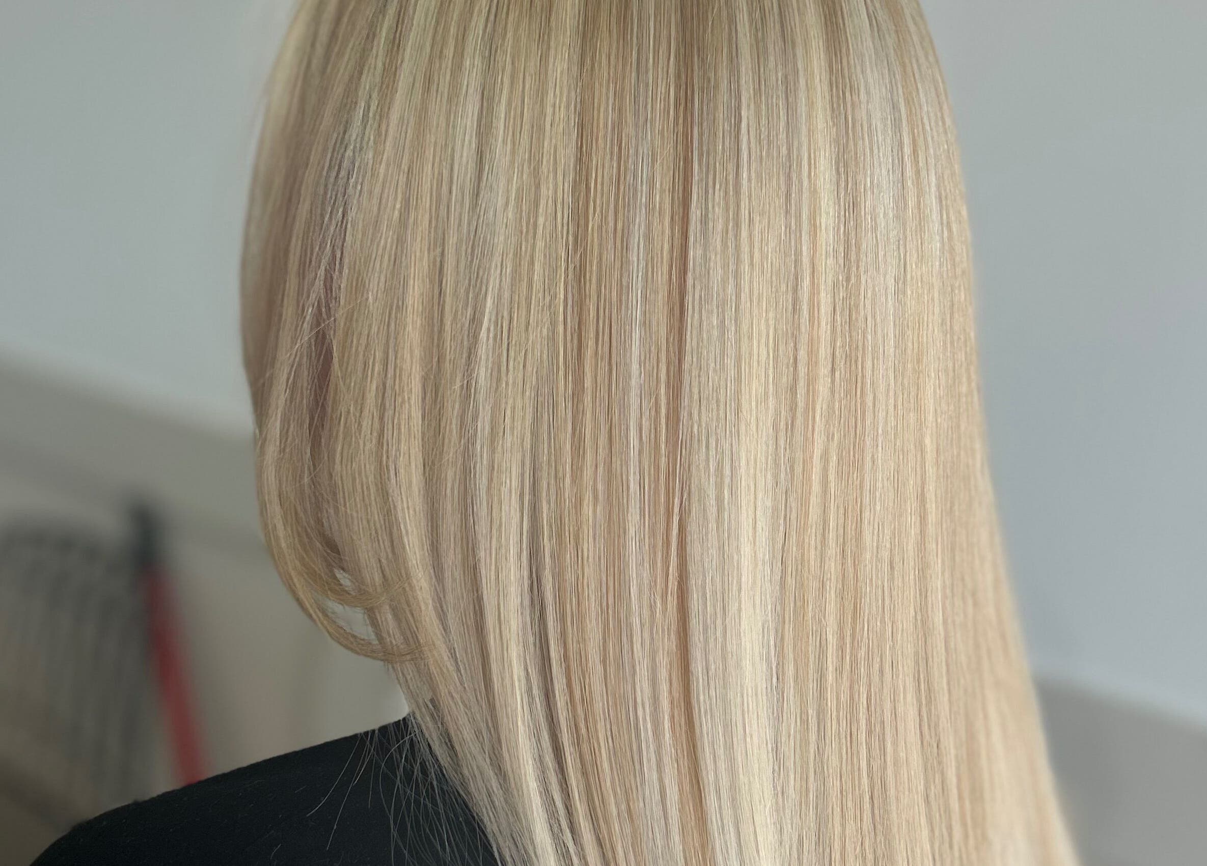 Sleek blonde hairstyle at Styled By Tee Swales in Hartlepool, England, GB, showcasing precise styling.