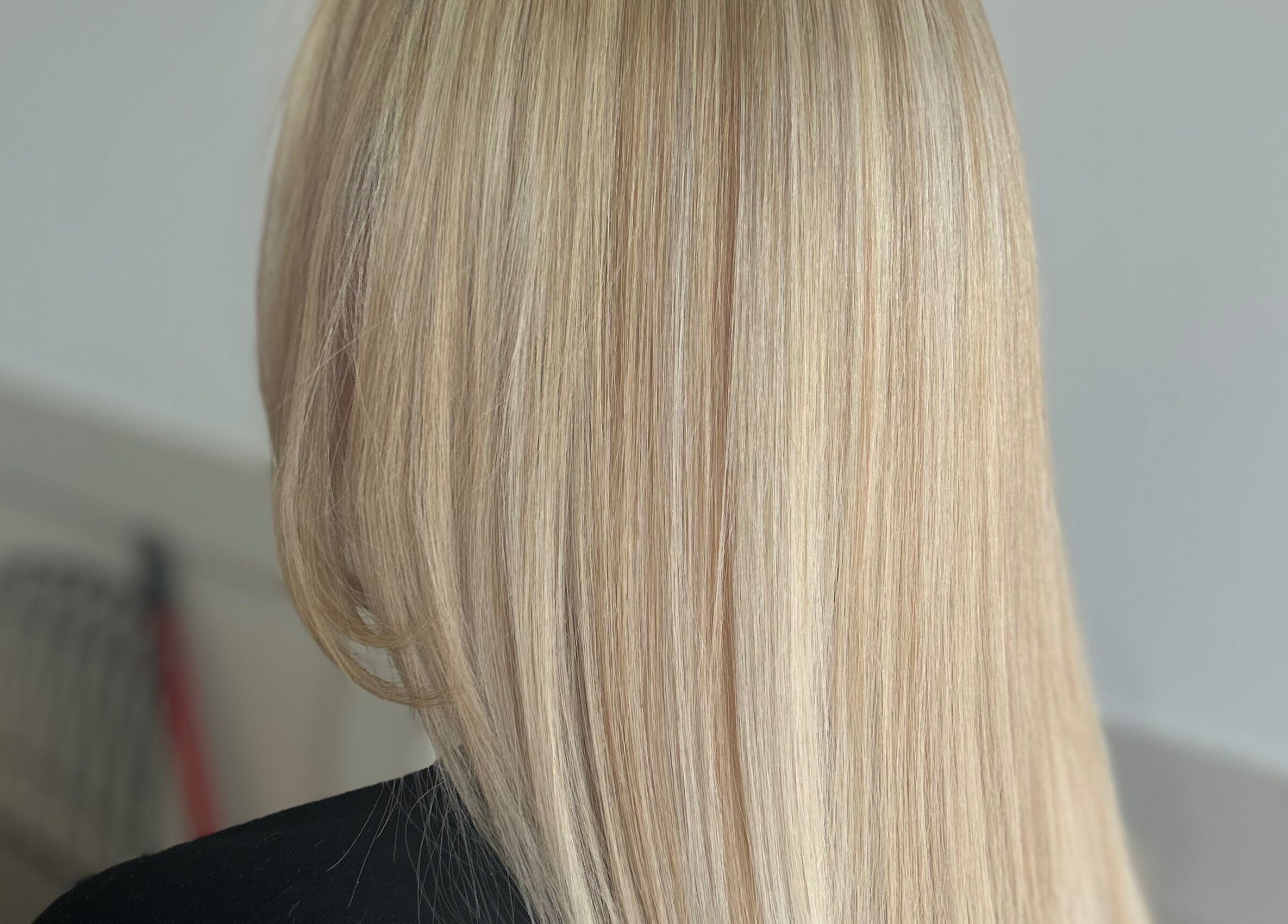Sleek blonde hairstyle at Styled By Tee Swales in Hartlepool, England, GB, showcasing precise styling.