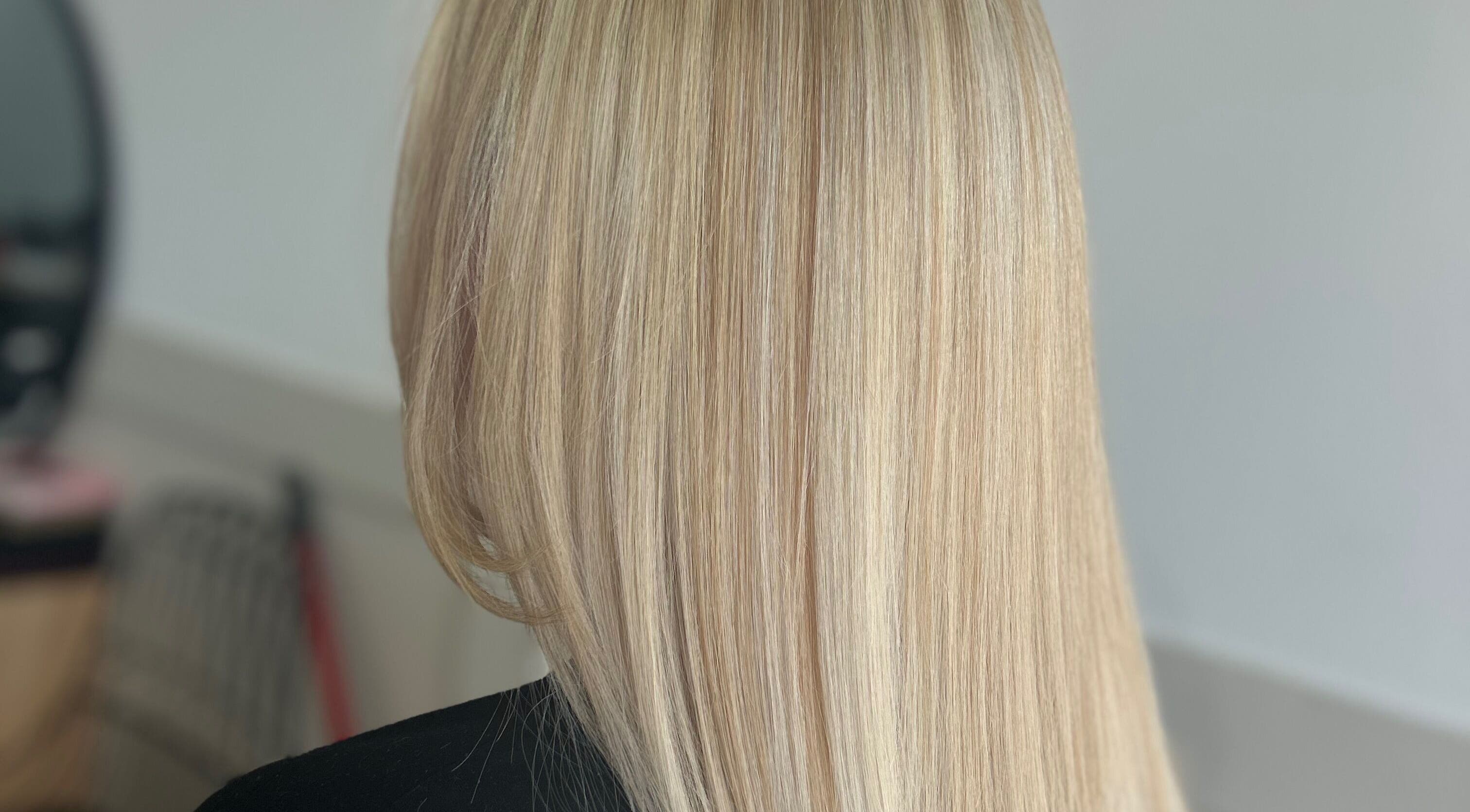 Sleek blonde hairstyle at Styled By Tee Swales in Hartlepool, England, GB, showcasing precise styling.