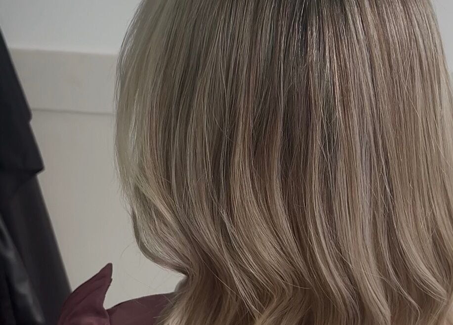 Styled By Tee Swales in Hartlepool, England. Close-up of elegantly styled blonde hair.