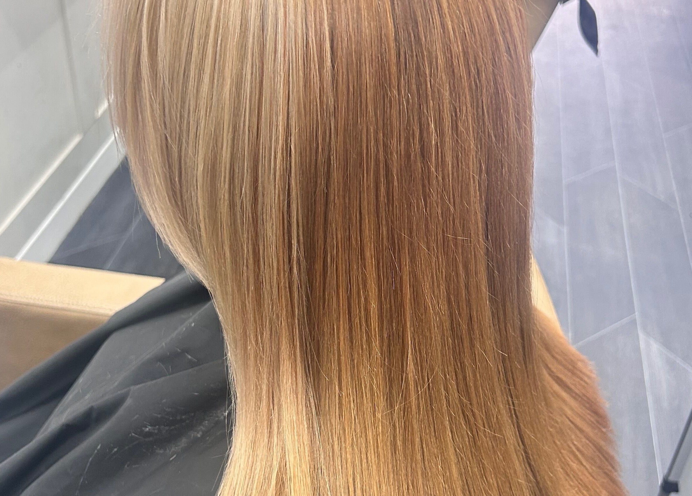 Styled By Tee Swales showcases smooth, golden brown hair in Hartlepool, England, GB.