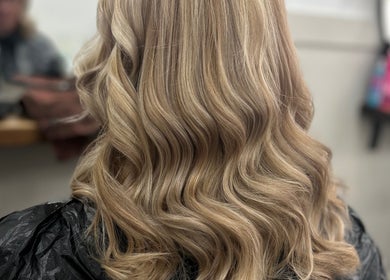 Elegant wavy blonde hairstyle at Styled By Tee Swales in Hartlepool, England, GB.