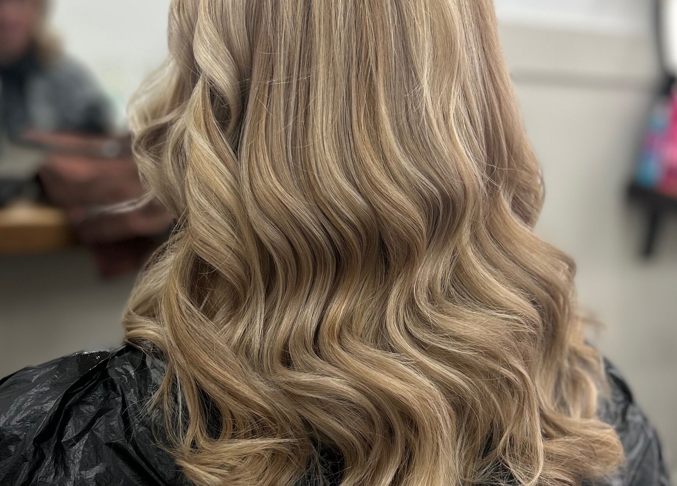 Elegant wavy blonde hairstyle at Styled By Tee Swales in Hartlepool, England, GB.