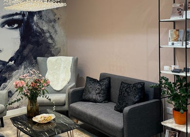 Modern lounge area at HAIRCULT, London, England, GB featuring chic decor and artistic wall art.