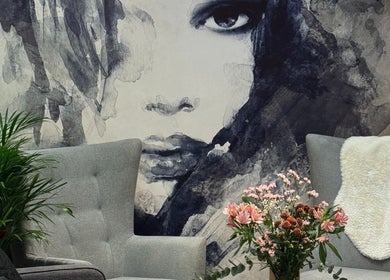 Elegantly decorated seating area in HAIRCULT, London, England, GB featuring a striking face mural.