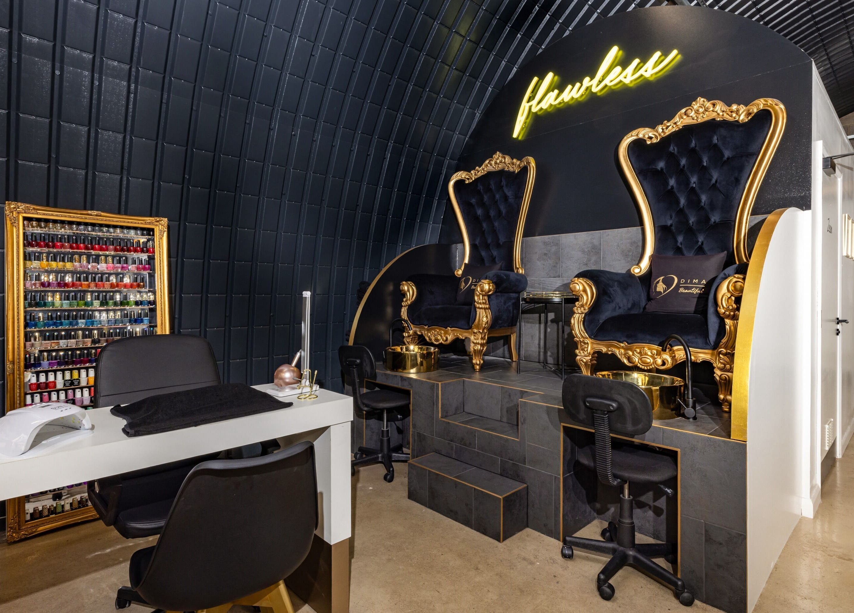 Luxurious nail salon at Dima Beautiful in London, England, GB, featuring elegant royal chairs and nail polish selection.