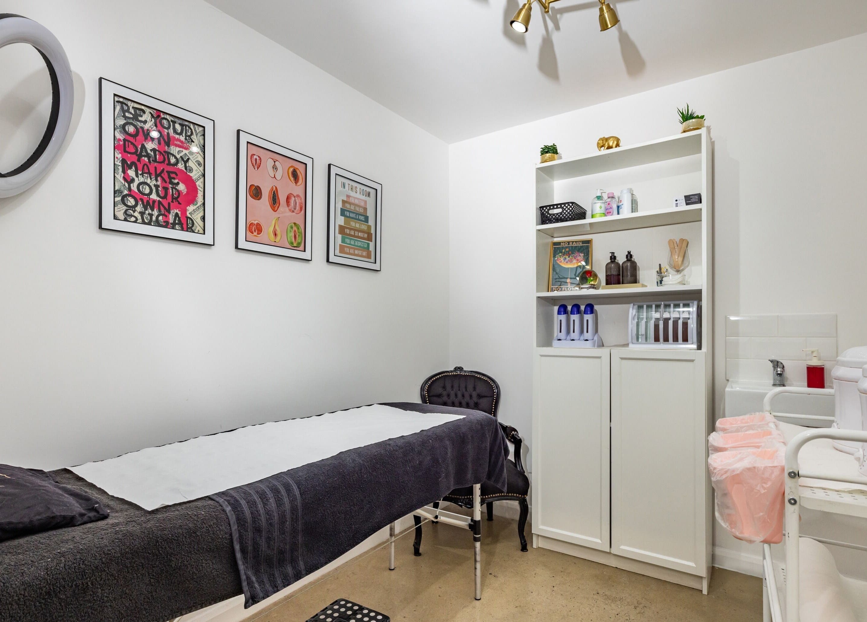 Modern treatment room at Dima Beautiful in London, England, GB with stylish decor and essential wellness tools.