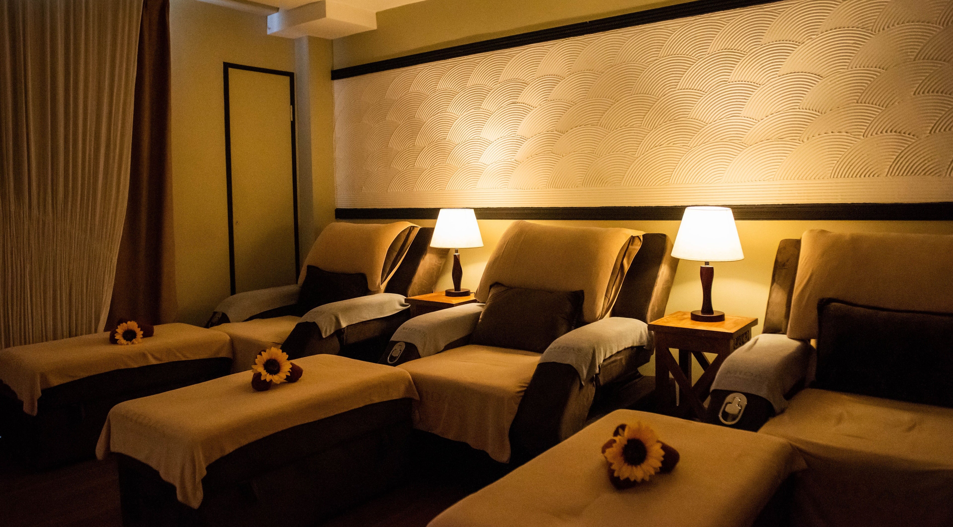 Cozy lounge chairs at Midas Wellness & Spa, Kota Kinabalu, Sabah, MY with soft lighting and elegant decor.