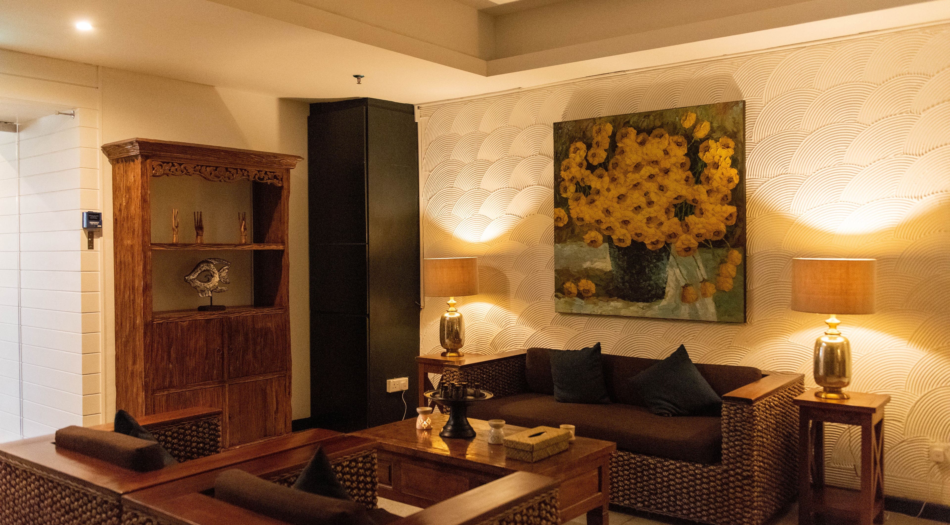 Cozy lounge at Midas Wellness & Spa, Kota Kinabalu, Sabah, MY with warm lighting and rustic decor.